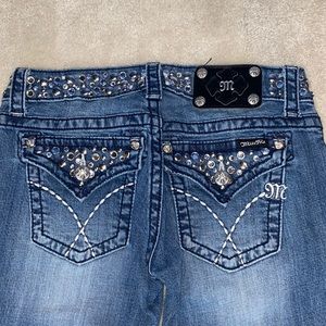 Miss Me skinny jeans with bejeweled belt area and pockets.